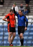 4 October 2020; Referee Alan Long shows Jerry O'Connor of Duhallow a yellow card during the Cork County Premier Senior Football Championship Semi-Final match between Nemo Rangers and Duhallow at Páirc Ui Rinn in Cork. Photo by Sam Barnes/Sportsfile