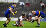 4 October 2020; Fionn Reilly of Gaeil Colmcille in action against Ben Wyer, left, and Ciaran O'Ferraigh of Ratoath during the Meath County Senior Football Championship Final match between Ratoath and Gaeil Colmcille at Páirc Táilteann in Navan, Meath. Photo by Brendan Moran/Sportsfile