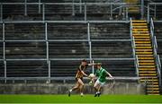 4 October 2020; Michael Daly of Mountbellew-Moylough takes on Conchuir Ó Bothain of Moycullen in front of the empty terrace during the Galway County Senior Football Championship Final match between Moycullen and Mountbellew-Moylough at Pearse Stadium in Galway. Photo by Seb Daly/Sportsfile