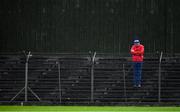 4 October 2020; A Gaeil Colmcille supporter stands in the rain during the Meath County Senior Football Championship Final match between Ratoath and Gaeil Colmcille at Páirc Táilteann in Navan, Meath. Photo by Brendan Moran/Sportsfile
