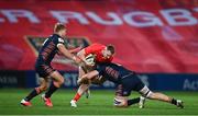 10 October 2020; Rory Scannell of Munster is tackled by Jaco van der Walt, left, and Nick Haining of Edinburgh during the Guinness PRO14 match between Munster and Edinburgh at Thomond Park in Limerick. Photo by Ramsey Cardy/Sportsfile