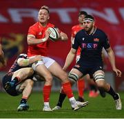 10 October 2020; Mike Haley of Munster is tackled by George Taylor of Edinburgh during the Guinness PRO14 match between Munster and Edinburgh at Thomond Park in Limerick. Photo by Ramsey Cardy/Sportsfile
