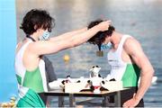 11 October 2020; Ireland rower Daire Lynch, left, presents team-mate Ronan Byrne with his medal after they won bronze in the Men’s Double Sculls M2x A Final during day three of the 2020 European Rowing Championships in Poznan, Poland. Photo by Jakub Piaseki/Sportsfile