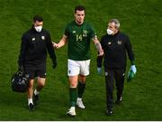 11 October 2020; Kevin Long of Republic of Ireland leaves the pitch with physiotherapist Kevin Mulholland, left, and team doctor Alan Byrne, right, after sustaining an injury during the UEFA Nations League B match between Republic of Ireland and Wales at the Aviva Stadium in Dublin. Photo by Eóin Noonan/Sportsfile