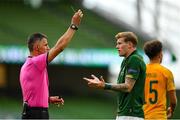 11 October 2020; James McClean of Republic of Ireland is shown a yellow card by referee Tasos Sidiropoulos during the UEFA Nations League B match between Republic of Ireland and Wales at the Aviva Stadium in Dublin. Photo by Seb Daly/Sportsfile
