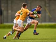 17 October 2020; Rory Finn of Wicklow in action against James McAuley, 6, and Kevin Quinn of Antrim during the Allianz Football League Division 4 Round 6 match between Wicklow and Antrim at the County Grounds in Aughrim, Wicklow. Photo by Ray McManus/Sportsfile