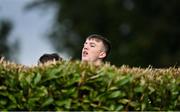 17 October 2020; A local spectator attempts to get a view of the game from behind a bush during the Allianz Football League Division 1 Round 6 match between Monaghan and Kerry at Grattan Park in Inniskeen, Monaghan. Photo by Brendan Moran/Sportsfile