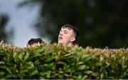 17 October 2020; A local spectator attempts to get a view of the game from behind a bush during the Allianz Football League Division 1 Round 6 match between Monaghan and Kerry at Grattan Park in Inniskeen, Monaghan. Photo by Brendan Moran/Sportsfile
