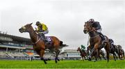 17 October 2020; Surrounding, left, with Ronan Whelan up, races alongside eventual second place Laughifuwant, with Gary Carroll up, on their way to winning the Knockaire Stakes at Leopardstown Racecourse in Dublin. Photo by Seb Daly/Sportsfile