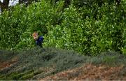 17 October 2020; A young local supporter attempts to get a view of the game through bushes during the Allianz Football League Division 1 Round 6 match between Monaghan and Kerry at Grattan Park in Inniskeen, Monaghan. Photo by Brendan Moran/Sportsfile