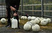 18 October 2020; Tyrone assistant kitman Martin Keenan sanitizes footballs prior to the Allianz Football League Division 1 Round 6 match between Donegal and Tyrone at MacCumhail Park in Ballybofey, Donegal. Photo by David Fitzgerald/Sportsfile