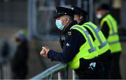 18 October 2020; A member of An Garda Síochána looks on from the terrace during the Allianz Football League Division 1 Round 6 match between Donegal and Tyrone at MacCumhail Park in Ballybofey, Donegal. Photo by David Fitzgerald/Sportsfile