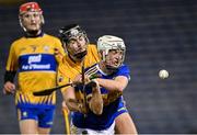 19 October 2020; Devon Ryan of Tipperary is hooked by Dylan McMahon of Clare as he prepares to shoot on goal during the Bord Gáis Energy Munster Hurling Under 20 Championship Quarter-Final match between Tipperary and Clare at Semple Stadium in Thurles, Tipperary. Photo by Piaras Ó Mídheach/Sportsfile