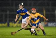 19 October 2020; Kian O'Kelly of Tipperary in action against Mike Gough of Clare during the Bord Gáis Energy Munster Hurling Under 20 Championship Quarter-Final match between Tipperary and Clare at Semple Stadium in Thurles, Tipperary. Photo by Piaras Ó Mídheach/Sportsfile