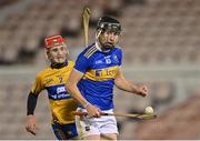 19 October 2020; Gearóid O'Connor of Tipperary is chased by Darragh Lohan of Clare during the Bord Gáis Energy Munster Hurling Under 20 Championship Quarter-Final match between Tipperary and Clare at Semple Stadium in Thurles, Tipperary. Photo by Piaras Ó Mídheach/Sportsfile