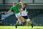 24 October 2020; Hugh Bourke of Limerick scores a point despite the attention of Eddie McGuinness of Sligo during the Allianz Football League Division 4 Round 7 match between Sligo and Limerick at Markievicz Park in Sligo. Photo by Harry Murphy/Sportsfile