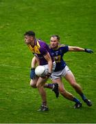 24 October 2020; Niall Hughers of Wexford in action against Dean Healy of Wicklow during the Allianz Football League Division 4 Round 7 match between Wexford and Wicklow at Chadwicks Wexford Park in Wexford. Photo by Sam Barnes/Sportsfile
