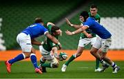 24 October 2020; Peter O'Mahony of Ireland offloads in the tackle by Federico Mori of Italy during the Guinness Six Nations Rugby Championship match between Ireland and Italy at the Aviva Stadium in Dublin. Photo by Ramsey Cardy/Sportsfile