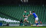 24 October 2020; Hugo Keenan of Ireland in action against Paolo Garbisi in front of empty stands during the Guinness Six Nations Rugby Championship match between Ireland and Italy at the Aviva Stadium in Dublin. Due to current restrictions laid down by the Irish government to prevent the spread of coronavirus and to adhere to social distancing regulations, all sports events in Ireland are currently held behind closed doors. Photo by Brendan Moran/Sportsfile