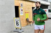 25 October 2020; Aidan O'Shea of Mayo runs past a coronavirus test centre station in the stadium before the Allianz Football League Division 1 Round 7 match between Mayo and Tyrone at Elverys MacHale Park in Castlebar, Mayo. Photo by Piaras Ó Mídheach/Sportsfile