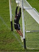 25 October 2020; Tyrone goalkeeper Niall Morgan fails to stop the ball going over the bar for a point, striking his hand off the crossbar in the process, before being treated by a medic, during the Allianz Football League Division 1 Round 7 match between Mayo and Tyrone at Elverys MacHale Park in Castlebar, Mayo. Photo by Piaras Ó Mídheach/Sportsfile