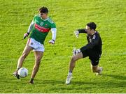 25 October 2020; Tommy Conroy of Mayo shoots to score his side's first goal past Tyrone goalkeeper Niall Morgan during the Allianz Football League Division 1 Round 7 match between Mayo and Tyrone at Elverys MacHale Park in Castlebar, Mayo. Photo by Piaras Ó Mídheach/Sportsfile