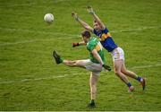 25 October 2020; Keith Beirne of Leitrim kicks a point under pressure from Alan Campbell of Tipperary during the Allianz Football League Division 3 Round 7 match between Leitrim and Tipperary at Avantcard Páirc Sean Mac Diarmada in Carrick-on-Shannon, Leitrim. Photo by Seb Daly/Sportsfile