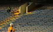 25 October 2020; A 'Maor' watches the game from an empty stand during the Munster GAA Hurling Senior Championship Quarter-Final match between Limerick and Clare at Semple Stadium in Thurles, Tipperary. This game also doubles up as the Allianz Hurling League Division 1 Final as the GAA season was shortened due to the coronavirus pandemic and both teams had qualified for the final. Photo by Ray McManus/Sportsfile