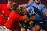 26 October 2020; Dan Goggin of Munster is tackled by Rey Lee-Lo of Cardiff Blues during the Guinness PRO14 match between Munster and Cardiff Blues at Thomond Park in Limerick. Photo by Ramsey Cardy/Sportsfile