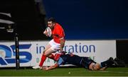 26 October 2020; JJ Hanrahan of Munster escapes the tackle of James Botham of Cardiff Blues on his way to scoring his side's fifth try during the Guinness PRO14 match between Munster and Cardiff Blues at Thomond Park in Limerick. Photo by Harry Murphy/Sportsfile