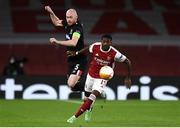 29 October 2020; Ainsley Maitland-Niles of Arsenal and Chris Shields of Dundalk during the UEFA Europa League Group B match between Arsenal and Dundalk at the Emirates Stadium in London, England. Photo by Ben McShane/Sportsfile