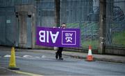 31 October 2020; An AIB sign is carried, by Shane Sterling, into the ground prior to the Ulster GAA Football Senior Championship Preliminary Round match between Monaghan and Cavan at St Tiernach’s Park in Clones, Monaghan. Photo by Stephen McCarthy/Sportsfile
