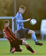 31 October 2020; Evan Weir of UCD is tackled by Shane Elworthy of Longford Town during the SSE Airtricity League First Division Play-off Semi-Final match between UCD and Longford Town at the UCD Bowl in Belfield, Dublin. Photo by Sam Barnes/Sportsfile