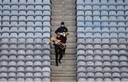 31 October 2020; Spare Kilkenny hurls are carried to the pitch by selectors Martin Comerford, rear, and James McGarry ahead of the Leinster GAA Hurling Senior Championship Semi-Final match between Dublin and Kilkenny at Croke Park in Dublin. Photo by Ramsey Cardy/Sportsfile