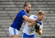 31 October 2020; Kieran Hughes of Monaghan is tackled by Killian Clarke of Cavan during the Ulster GAA Football Senior Championship Preliminary Round match between Monaghan and Cavan at St Tiernach’s Park in Clones, Monaghan. Photo by Stephen McCarthy/Sportsfile