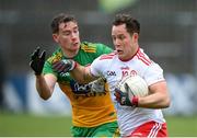 1 November 2020; Kieran McGeary of Tyrone in action against Ciaran Thompson of Donegal during the Ulster GAA Football Senior Championship Quarter-Final match between Donegal and Tyrone at MacCumhaill Park in Ballybofey, Donegal. Photo by Stephen McCarthy/Sportsfile