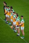 1 November 2020; Niall McNamee of Offaly, near, stands alongside his team-mates during the national anthem prior to the Leinster GAA Football Senior Championship Round 1 match between Offaly and Carlow at Bord na Mona O'Connor Park in Tullamore, Offaly. Photo by Seb Daly/Sportsfile