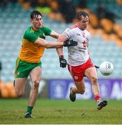 1 November 2020; Kieran McGeary of Tyrone in action against Michael Langan of Donegal during the Ulster GAA Football Senior Championship Quarter-Final match between Donegal and Tyrone at MacCumhaill Park in Ballybofey, Donegal. Photo by Stephen McCarthy/Sportsfile