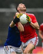 1 November 2020; John Cluttercuck of Louth is tackled by Gary Rogers of Longford during the Leinster GAA Football Senior Championship Round 1 match between Louth and Longford at TEG Cusack Park in Mullingar, Westmeath. Photo by Eóin Noonan/Sportsfile