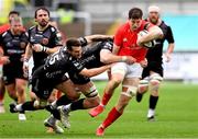 1 November 2020; Jack O’Donoghue of Munster is tackled by Matthew Screech and Josh Lewis of Dragons during the Guinness PRO14 match between Dragons and Munster at Rodney Parade in Newport, Wales. Photo by Ben Evans/Sportsfile