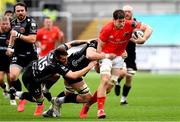 1 November 2020; Jack O’Donoghue of Munster is tackled by Matthew Screech and Josh Lewis of Dragons during the Guinness PRO14 match between Dragons and Munster at Rodney Parade in Newport, Wales. Photo by Ben Evans/Sportsfile
