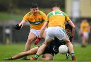 1 November 2020; Tommy Conroy of Mayo is tackled by Domnnaill Flynn, left, and Shane Quinn of Leitrim during the Connacht GAA Football Senior Championship Quarter-Final match between Leitrim and Mayo at Avantcard Páirc Sean Mac Diarmada in Carrick-on-Shannon, Leitrim. Photo by Ramsey Cardy/Sportsfile