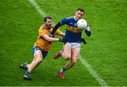1 November 2020; Conor Sweeney of Tipperary in action against Kevin Harnett of Clare during the Munster GAA Football Senior Championship Quarter-Final match between Tipperary and Clare at Semple Stadium in Thurles, Tipperary. Photo by Diarmuid Greene/Sportsfile