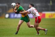 1 November 2020; Ciaran Thompson of Donegal is tackled by Tiernan McCann of Tyrone during the Ulster GAA Football Senior Championship Quarter-Final match between Donegal and Tyrone at MacCumhaill Park in Ballybofey, Donegal. Photo by Stephen McCarthy/Sportsfile