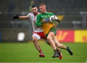 1 November 2020; Oisin Gallen of Donegal in action against Conor McKenna of Tyrone during the Ulster GAA Football Senior Championship Quarter-Final match between Donegal and Tyrone at MacCumhaill Park in Ballybofey, Donegal. Photo by Stephen McCarthy/Sportsfile