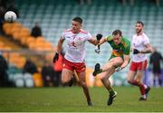1 November 2020; Ciaran Thompson of Donegal kicks a point despite the attention of of Michael McKernan of Tyrone during the Ulster GAA Football Senior Championship Quarter-Final match between Donegal and Tyrone at MacCumhaill Park in Ballybofey, Donegal. Photo by Stephen McCarthy/Sportsfile
