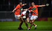 1 November 2020; Ciaran McFaul of Derry in action against Jamie Clarke, left, and James Morgan of Armagh during the Ulster GAA Football Senior Championship Quarter-Final match between Derry and Armagh at Celtic Park in Derry. Photo by David Fitzgerald/Sportsfile