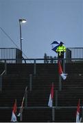 1 November 2020; A steward looks on during heavy rain fall during the Ulster GAA Football Senior Championship Quarter-Final match between Derry and Armagh at Celtic Park in Derry. Photo by David Fitzgerald/Sportsfile