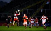 1 November 2020; Padraig Cassidy of Derry claims a kickout ahead of Stefan Campbell of Armagh during the Ulster GAA Football Senior Championship Quarter-Final match between Derry and Armagh at Celtic Park in Derry. Photo by David Fitzgerald/Sportsfile