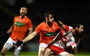 1 November 2020; Niall Loughlin of Derry in action against Callum Cumiskey of Armagh during the Ulster GAA Football Senior Championship Quarter-Final match between Derry and Armagh at Celtic Park in Derry. Photo by David Fitzgerald/Sportsfile